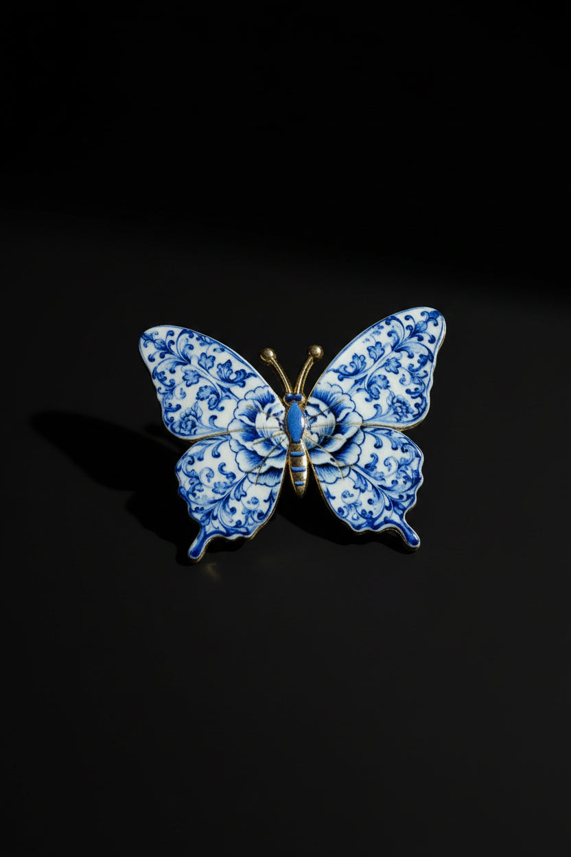 White and blue porcelain floral butterfly pin with antique gold hardware